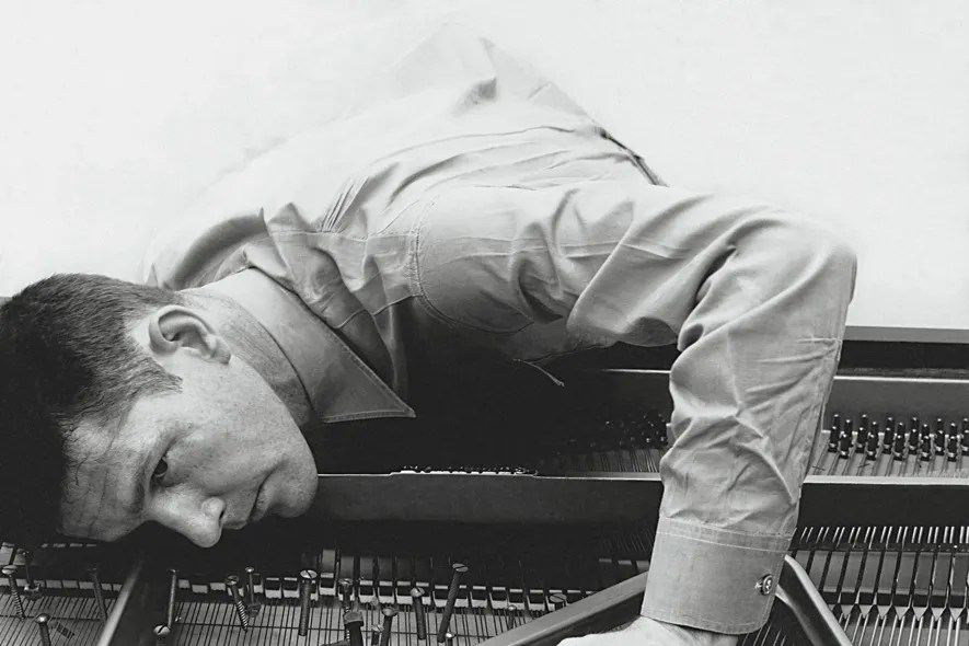 Cage preparing a piano, in 1947. Photograph by Irving Penn / © 1947 (Renewed 1975) Condé Nast Publications Inc.